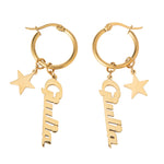 Gold hoop earrings with star and key charms on a white background