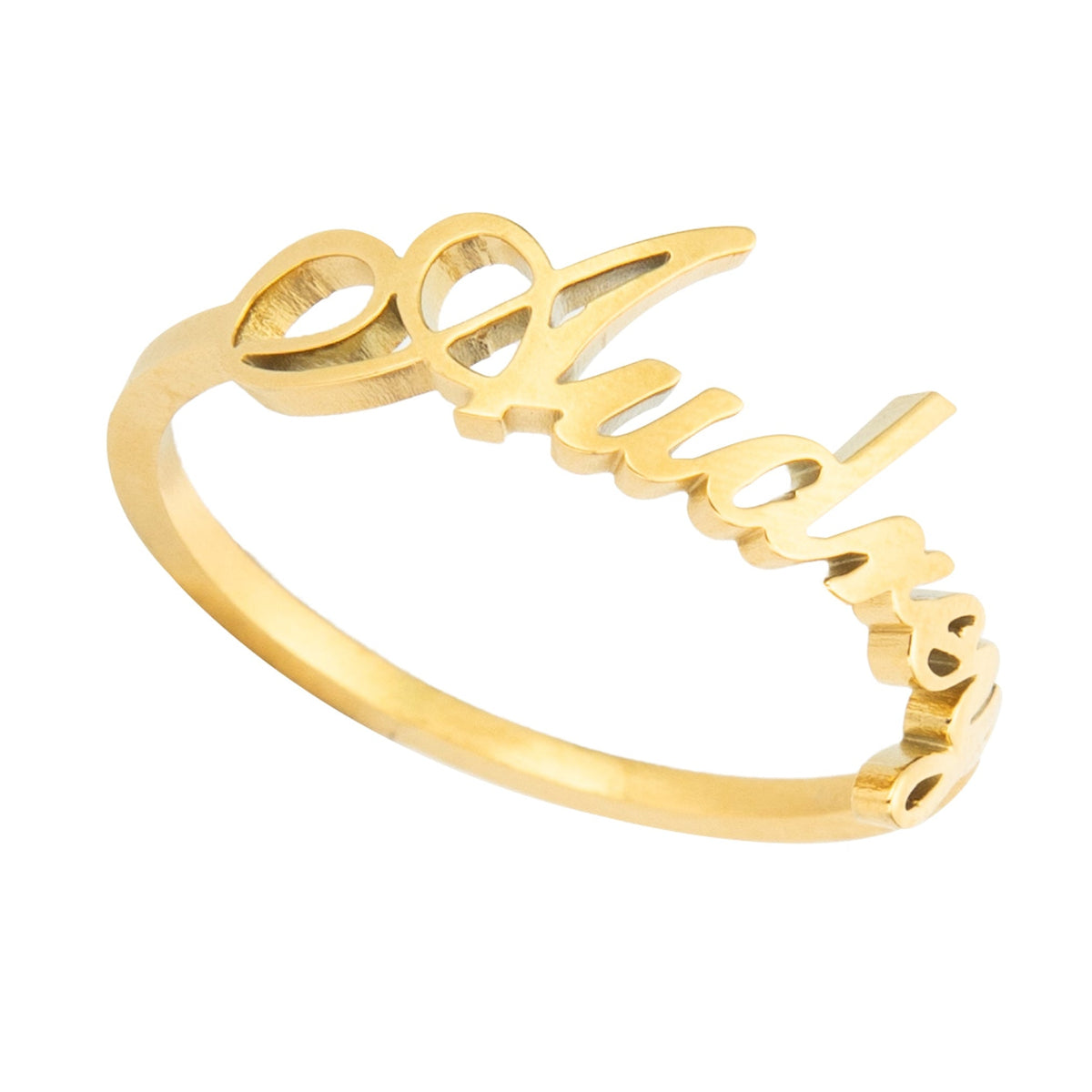 A gold-colored band ring with the word 'Audrey' engraved on it.