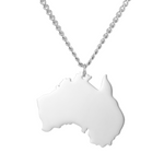 White pendant shaped like Australia on a silver chain against a white background.
