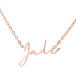 Rose gold necklace with 'Jade' pendant on a white background